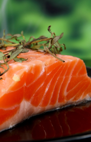 Summer food, rose colored fish steak in a wine marinade